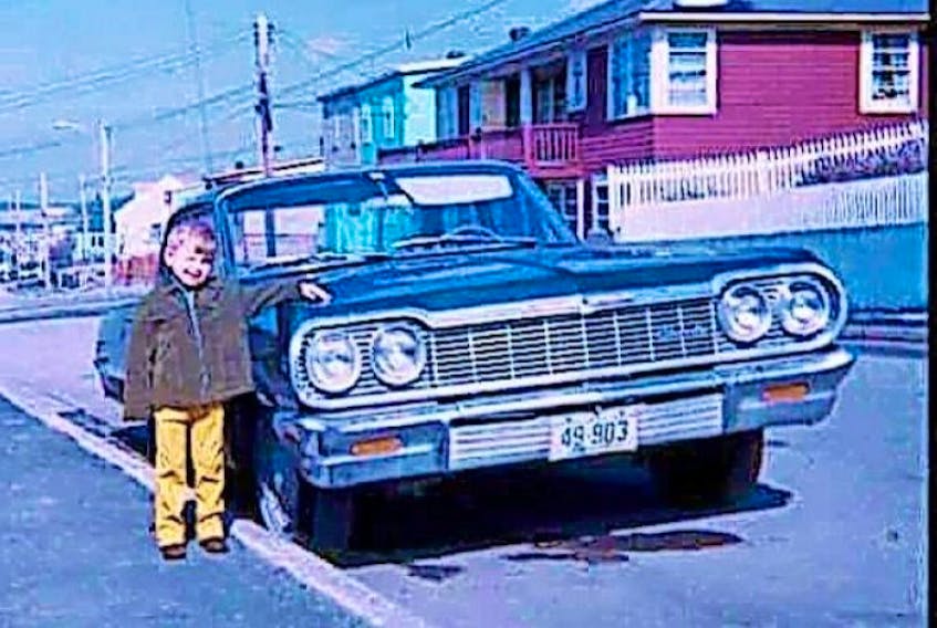 Rod Hand poses beside his father Gary’s car around 1970 on Goodridge Street in St. John’s.