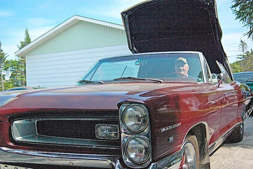 Acreman pops the top on his 1966 Pontiac Parisienne convertible. According to Wikipedia, “the Parisienne was the Canadian nameplate for the top of the line model sold in GM of Canada's Pontiac showrooms.”