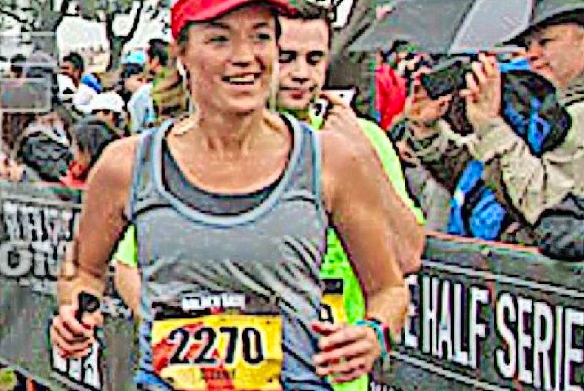Jeanie Fowler of St. Anthony crosses the finish line during the Golden Gate Half Marathon in San Francisco on November 8.