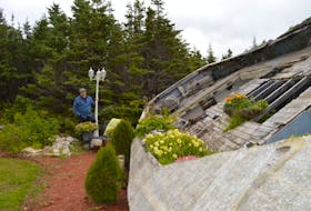 With growing vines, flowers and lobster pots, the relic of a ship on Frank Noseworthy’s lawn is just one of a variety of projects for the multi-skilled machinist.