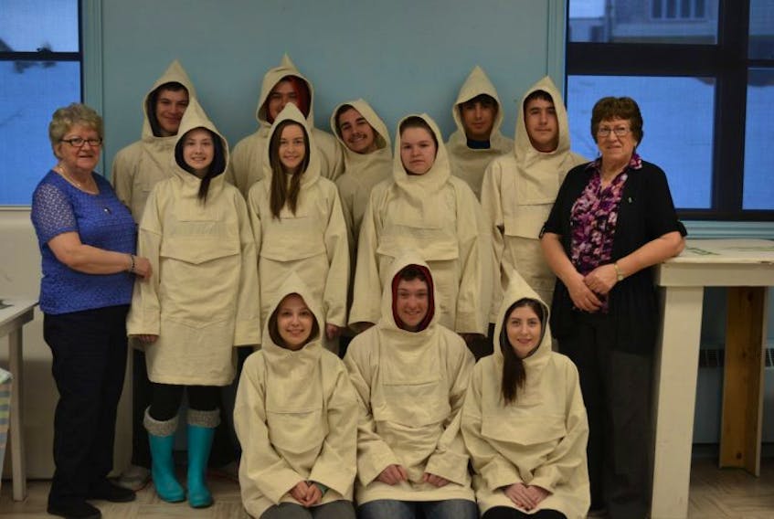 St. Mary’s All Grade students pose for a final picture each wearing their finished cossacks proudly (with resource people Olive Rumbolt and Verna Pye).