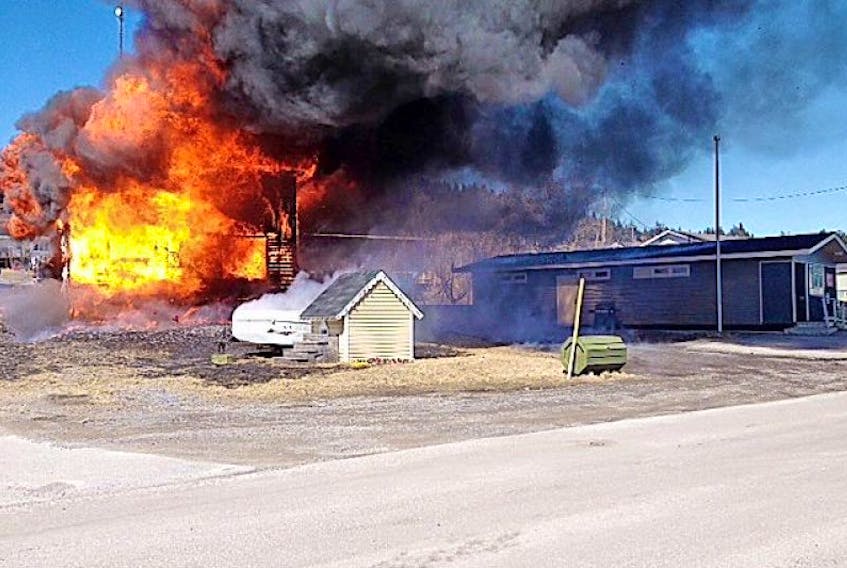 The two-story home of a Port Saunders family of three burned to the ground on April 18