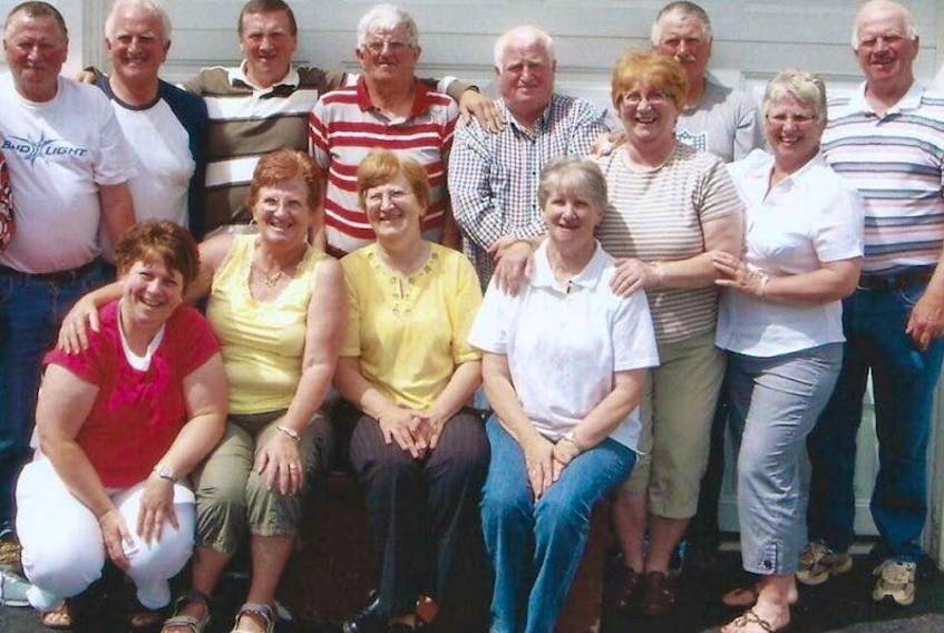 All 13 members of the Lowe family in Port Saunders. Back row (l to r) – Mark, Tom, Dennis, Gerald, Bill, John and Martin Lowe. Front row (l to r) – Colleen Lowe, Donna Dennis, Mary Payne, Gertrude Caines, Hilda Lowe, and Janet MacSween.