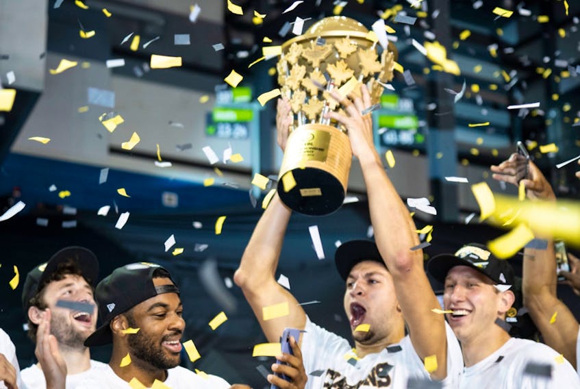 Edmonton Stingers forward Brody Clarke lifts the championship trophy after defeating the Fraser Valley Bandits 90-73 to win the Canadian Elite Basketball League Summer Series final at Meridian Centre in St. Catharines, Ont., on Aug. 9, 2020.