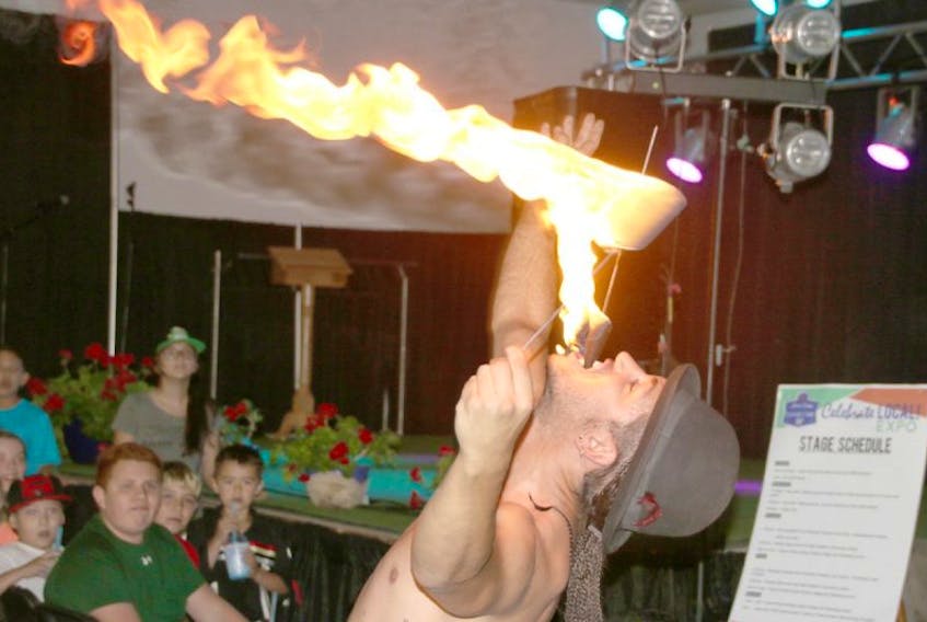 In this TC Media file photo, a fire artist breaths fire during an Atlantic Cirque show.