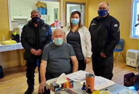 Elder Willie Ford of Makkovik was the first resident in Nunatsiavut to receive the Moderna COVID-19 vaccine Monday morning. Pictured are (from left) ordinary member John Anderson, Ford, public health nurse Betty Sampson and AngajukKâk Barry Andersen, Makkovik Inuit Community Government. CONTRIBUTED