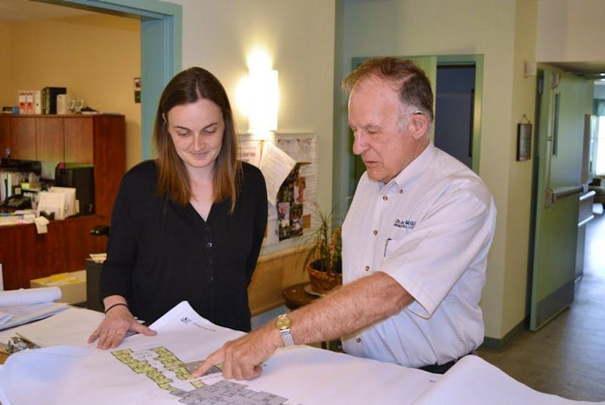 <p>Douglas MacKenzie, owner and operator of the Dr. John M. Gillis Memorial Lodge in Belfast, study expansion plans with Kathy Wilson-Taylor, administrator. The lodge is modernizing a portion of the existing facility and adding more rooms this fall. When all is said and done, there will be room for an additional 19 residents.</p>