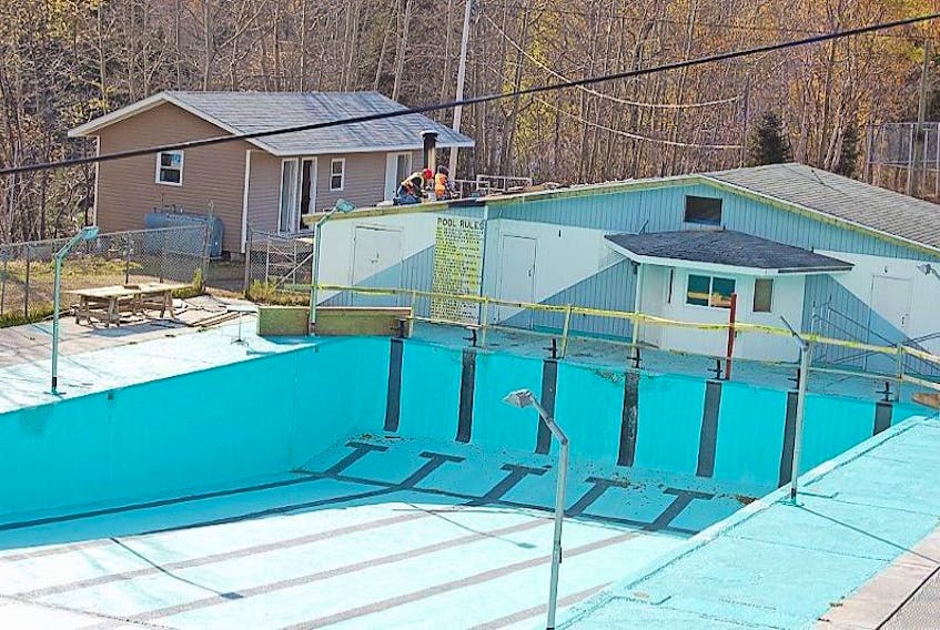 ['A couple roofers were spotted making repairs to Baie Verte recreation’s swimming pool facility, utilized by children from various communities, as well as the Baie Verte Dolphins competitive summer swim club.']