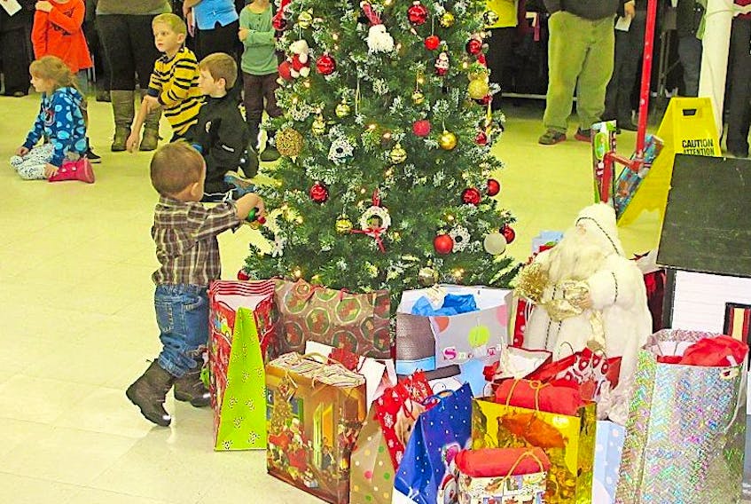 Springdale area residents young and old gathered around during festivities at the Thrift Store to help families in need.