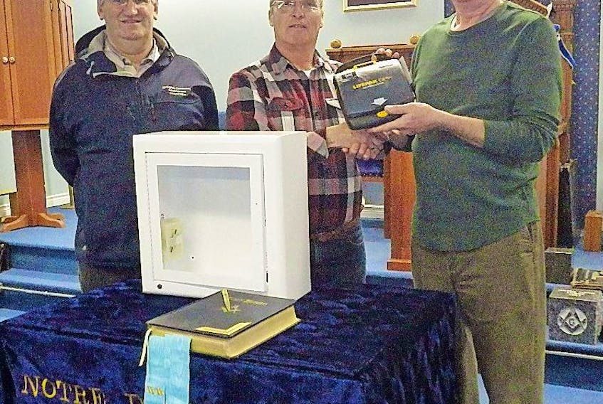 As part of the Springdale Community Development Co-op’s project of supplying all public buildings in Springdale with Lifepak CPR automatic external defibrillators this month one was placed at the Masonic Lodge. Taking part in the presentation were, from left, Melvin Butt, president of the Co-op, Harry Oxford, Co-op member; and Bruce White, Worshipful Master of the Masonic Lodge.