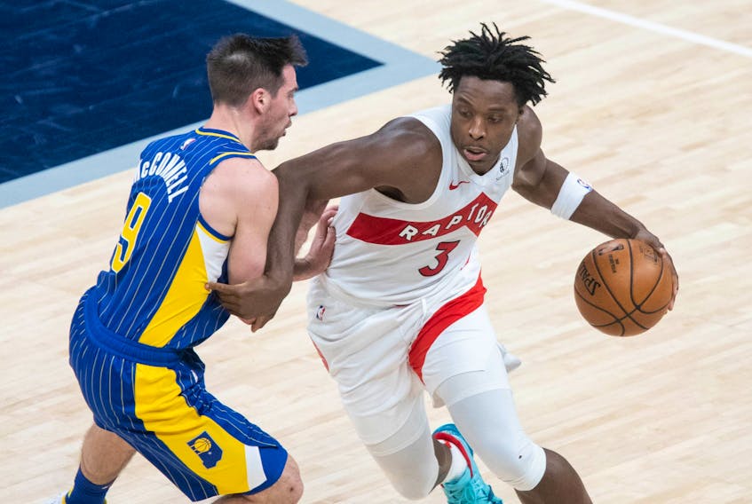 Raptors' OG Anunoby (right) dribbles the ball while Indiana Pacers' T.J. McConnell defends during the fourth quarter at Bankers Life Fieldhouse on Sunday, Jan. 24, 2021. 