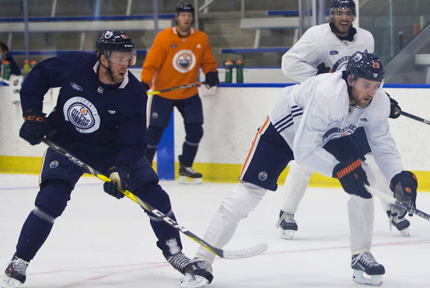 Connor McDavid chases after Leon Draisaitl during Day 2 of the Edmonton Oilers return-to-play camp at the Downtown Community Arena on Tuesday, July 14, 2020.