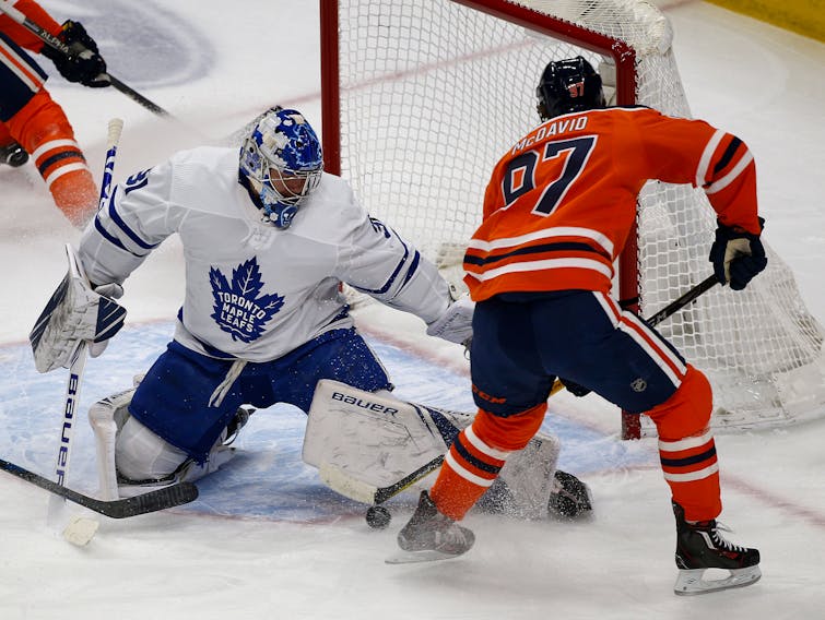  Toronto Maple Leafs goalie Frederik Andersen (left) makes a save on Edmonton Oilers captain Connor McDavid during first period NHL hockey game action in Edmonton on Saturday December 14, 2019. Larry Wong / Postmedia