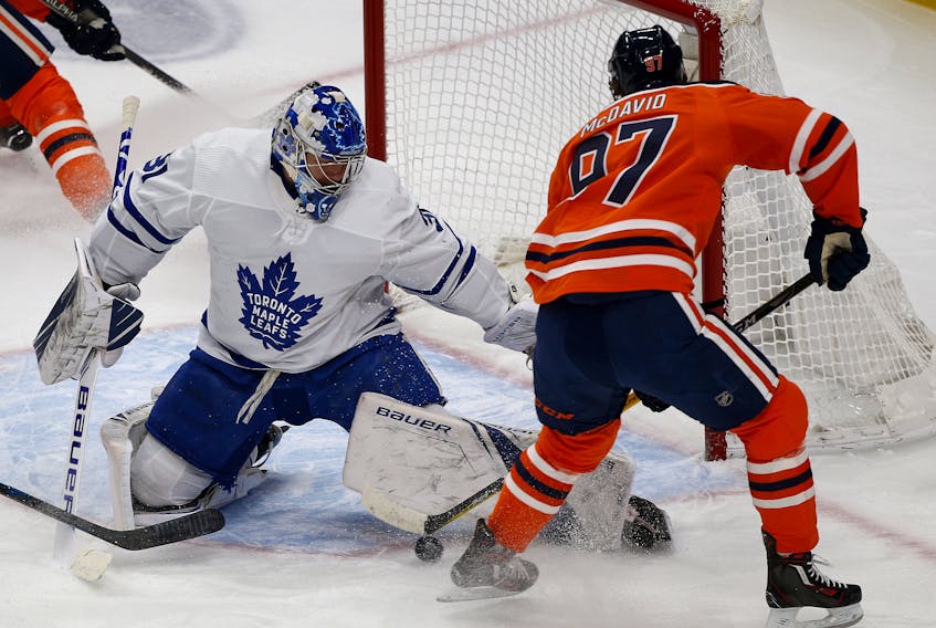  Toronto Maple Leafs goalie Frederik Andersen (left) makes a save on Edmonton Oilers captain Connor McDavid during first period NHL hockey game action in Edmonton on Saturday December 14, 2019. Larry Wong / Postmedia