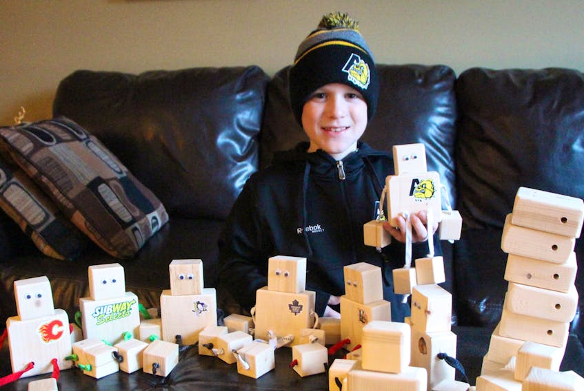 Oliver Smith displays some OllieBots in his Antigonish County living room in late 2017, when our Casket readers first met the young fundraiser. The passionate hockey fan and crusader against Ewing Sarcoma, a rare bone cancer he was diagnosed with when he was only 10, passed away June 27, one day after turning 12. Corey LeBlanc