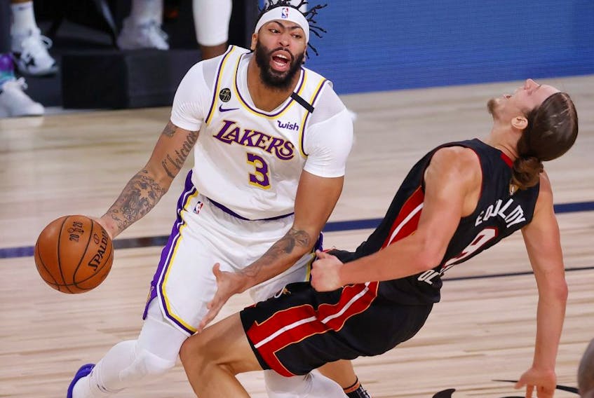 Anthony Davis of the Los Angeles Lakers is called for a foul against Kelly Olynyk of the Miami Heat during the first half in Game Three of the 2020 NBA Finals on Oct. 4, 2020, in Lake Buena Vista, Fla.
