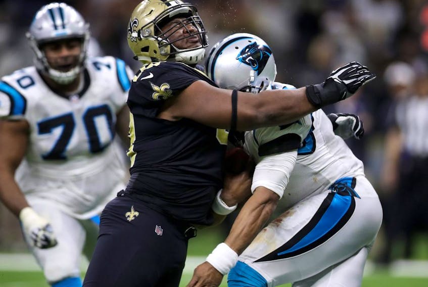 David Onyemata of the New Orleans Saints tackles Cam Newton of the Carolina Panthers at the Mercedes-Benz Superdome on January 7, 2018 in New Orleans. (Chris Graythen/Getty Images)