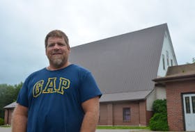 In this 2017 file photo, Open Arms executive director and Kentville town councillor John Andrew stands beside the former Kentville Christian Reform Church building on Oakdene Avenue. An affordable housing development had been proposed for the property. FILE PHOTO