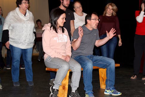 Working on a scene during a past rehearsal for Nelson dormait. On the bench: Ginette Cottreau and Philippe Cottreau. Standing behind them, from left: Leona Doucette, Leo LeBlanc, Mia White and Monica LeBlanc. ERIC BOURQUE