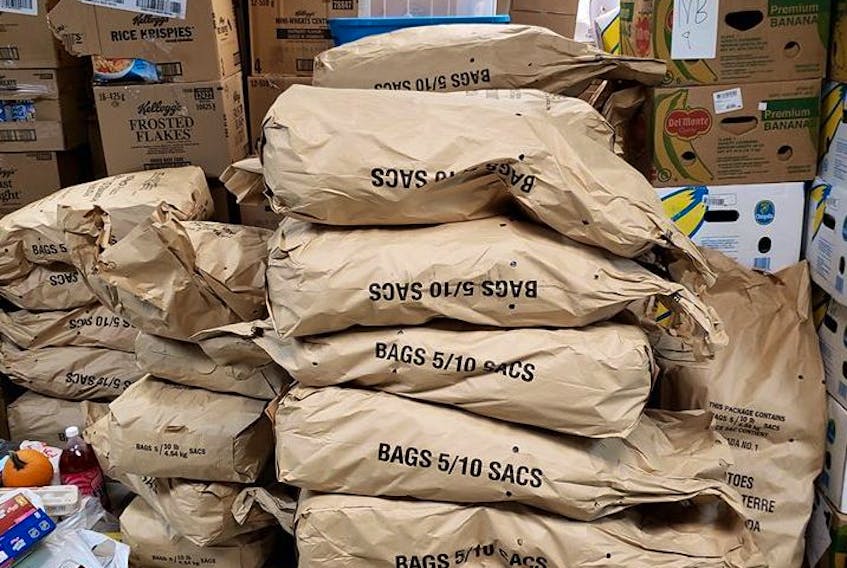 Bags of P.E.I. potatoes are stored at a warehouse along with other food in this undated photo.