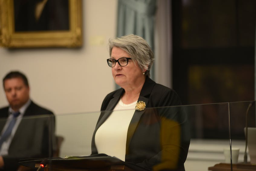 Finance Minister Darlene Compton delivers her budget address in the legislature June 17.