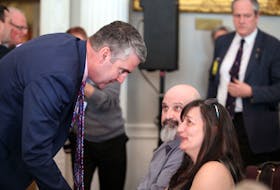 Premier Stephen McNeil speaks to organ recipient Cindy Ryan at Province House on Tuesday after he announced changes to organ and tissue legislation. Ryan has received two liver transplants since 2013 after she contracted a virus that attacked her liver. - Eric Wynne