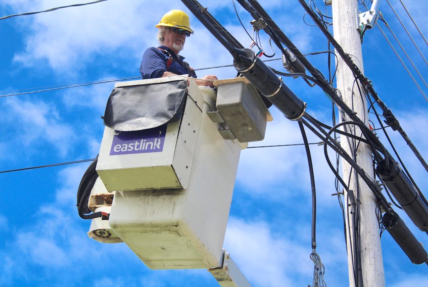 Eastlink line technician Steve Graham performs some maintenance along Westmount Road on Monday. Graham has been working the lines since 1977. “I’m the original cable guy,” he said with a laugh. Chris Connors • Cape Breton Post