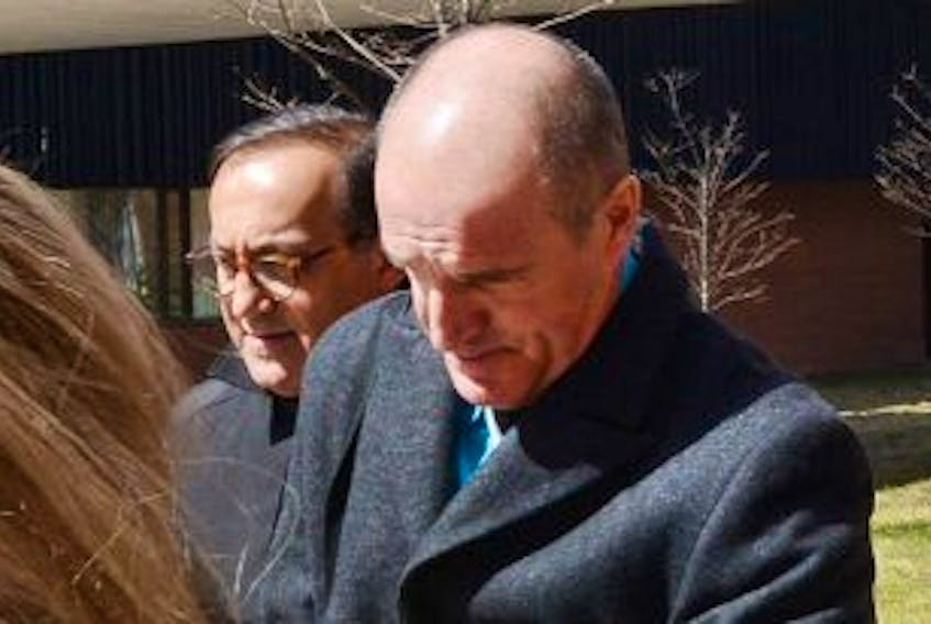 ['Gregory Campbell, right, is shown with his lawyer, Peter Ghiz, outside of provincial court in Charlottetown in this file photo.']