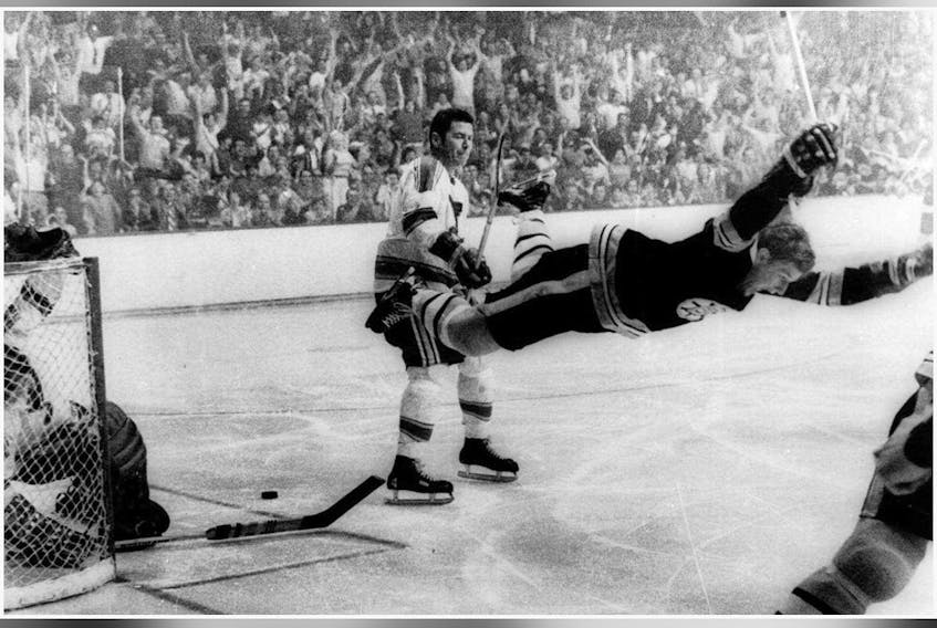 In this May 10, 1970, file photo, Boston Bruins' Bobby Orr goes into the air after scoring a goal against the St. Louis Blues that won the Stanley Cup for the Bruins in Boston.