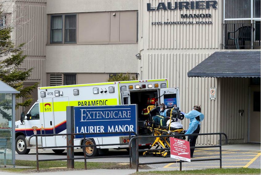 OTTAWA - April 24, 2020 - Paramedics preparing to enter Laurier Manor on Montreal Road.    
