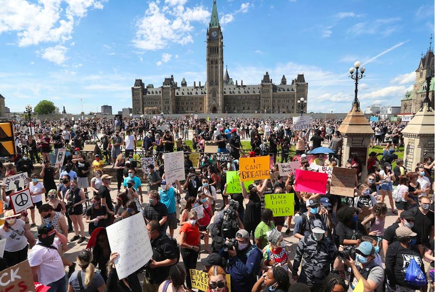 Thousands of people gathered to join a Black Lives Matter protest and a support march for march for George Floyd in downtown Ottawa Friday June 5, 2020.   
