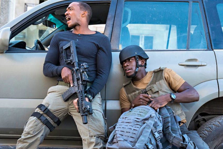 Medic! Script doctor! Anthony Mackie (left) and Damson Idris in Outside the Wire.