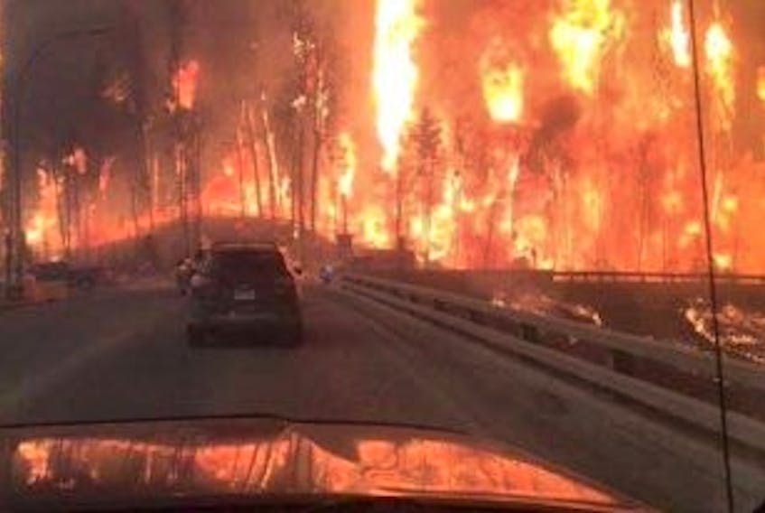 ['Sara MacKinnon of Westville took these pictures as she fled Fort McMurray.']