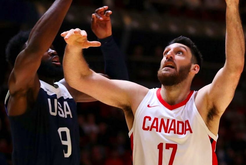 Owen Klassen of Canada (right) lays up a shot during the International Friendly Basketball match against the U.S. at Qudos Bank Arena in Sydney, Australia, on Aug. 26, 2019.