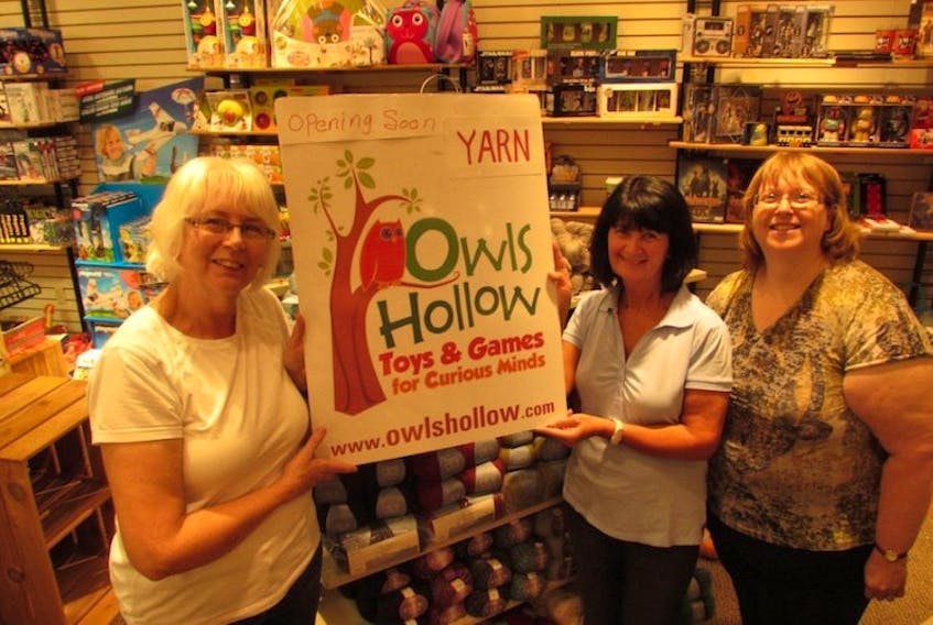 <span>Betty Caseley, left, Pam Carragher and Heather Smith stand in the new temporary home of Owls Hollow in the Confederation Court Mall.<br /></span>