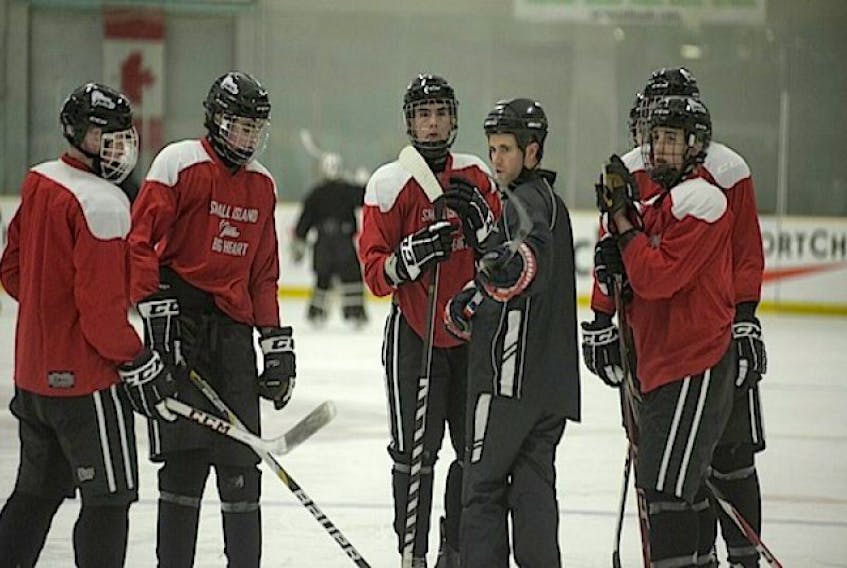 P.E.I.’s Canada Games men’s hockey team listens to assistant coach Mark Carragher Sunday in Prince George, B.C.