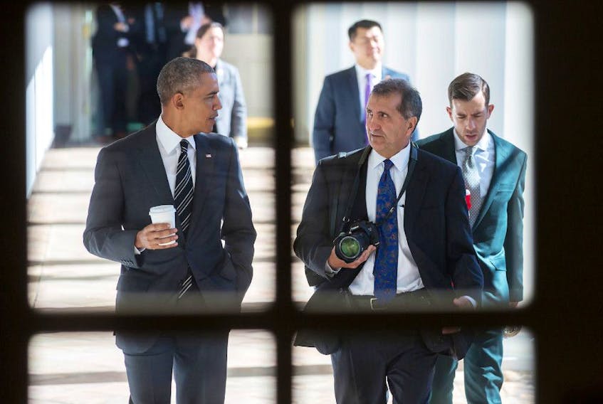 Focused: President Barack Obama chats with chief White House photographer Pete Souza.