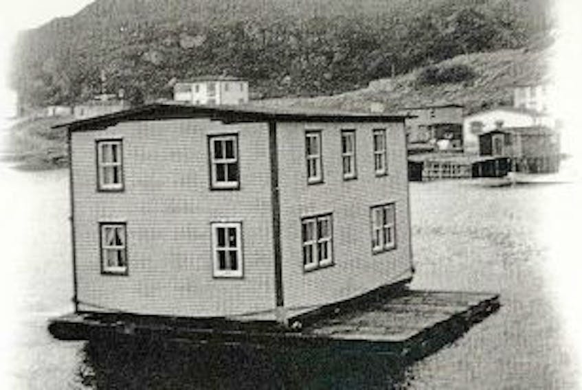 ['Packet file photo<br />When people moved from the islands of Placentia Bay to places like Arnold’s Cove during the Smallwood government’s resettlement program of the 1960s, some of them brought their homes with them, floating them across the water to be set up in their new home.<br /><br />']