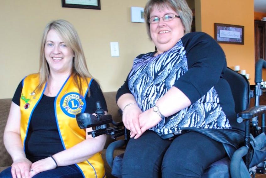The Random Lion’s Club has undertaken a project to help a local family purchase a wheelchair accessible van. Pictured on the left is friend and Lion’s Club volunteer Melanie Pitcher and Petley resident Tammy Clenche.