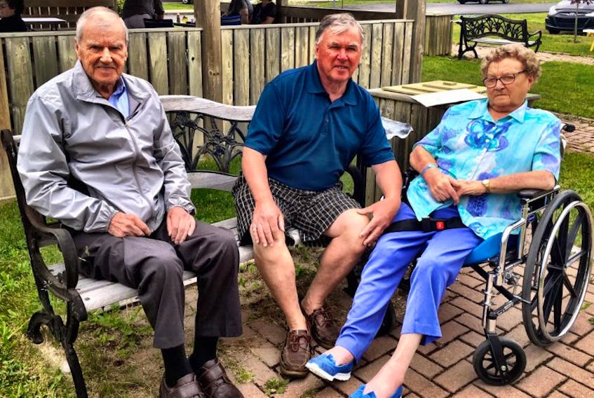 Dorothy Vardy with her husband, Roy (left) and son, Bill (centre) this past summer in Clarke’s Beach. Mrs. Vardy died in December 2016.