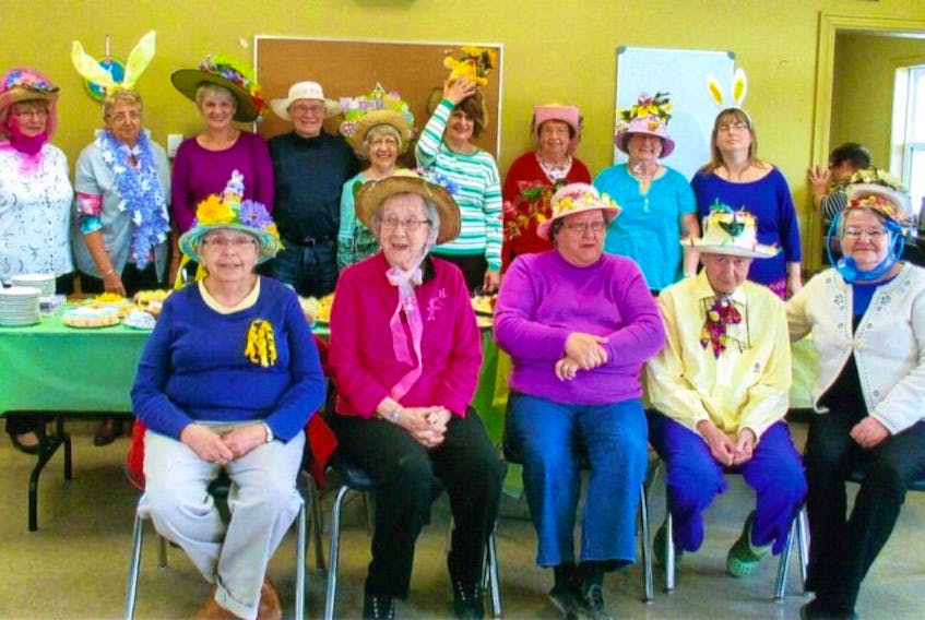 GATHER members are proud to show off their Easter Bonnet creations.