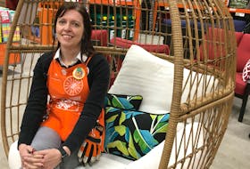 Pam Browne, seen in one of the stores's new outdoor seats, the Cayman egg chair, is the manager of Home Depot in St. John's. The store is among the many that's rolling out spring and summer items, while retaining some winter essentials such as salt and some shovels. BARB SWEET/THE TELEGRAM