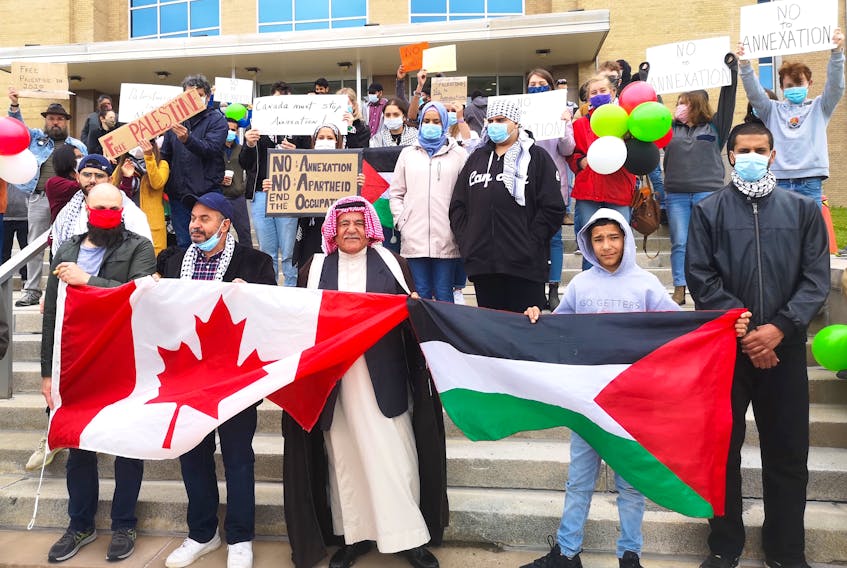 People gathered at Confederation Building on Saturday to show solidarity with Palestinians as the Israeli government continues to make plans to annex parts of the West Bank. -Andrew Waterman/The Telegram