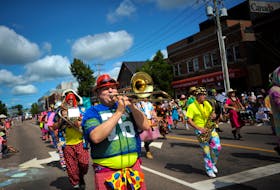 Members of the Clash Band make their way down Great George Street during the Gold Cup Parade on Friday, Aug. 17. 2018. Nathan Rochford/The Guardian