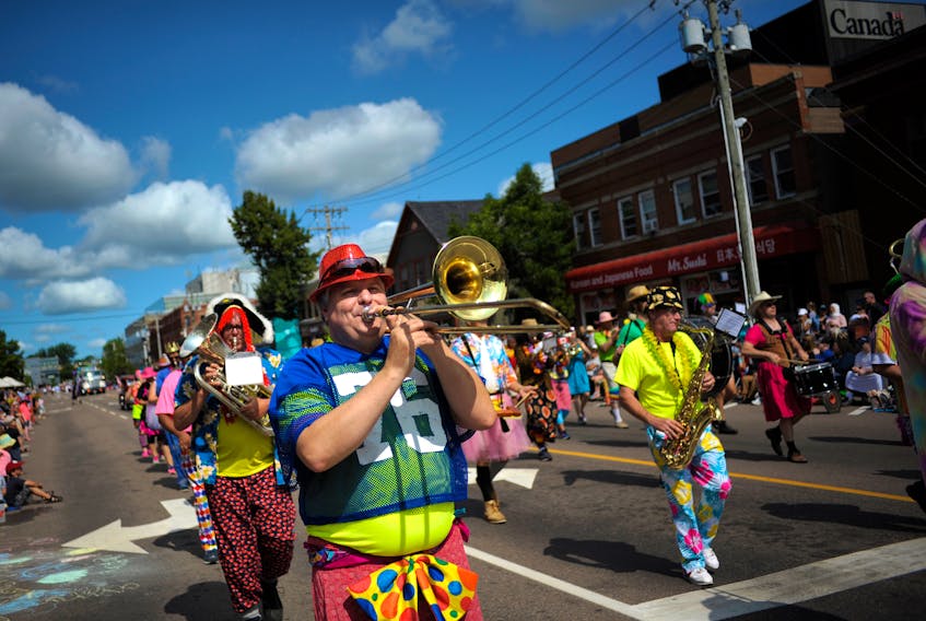 Members of the Clash Band make their way down Great George Street during the Gold Cup Parade on Friday, Aug. 17. 2018. Nathan Rochford/The Guardian