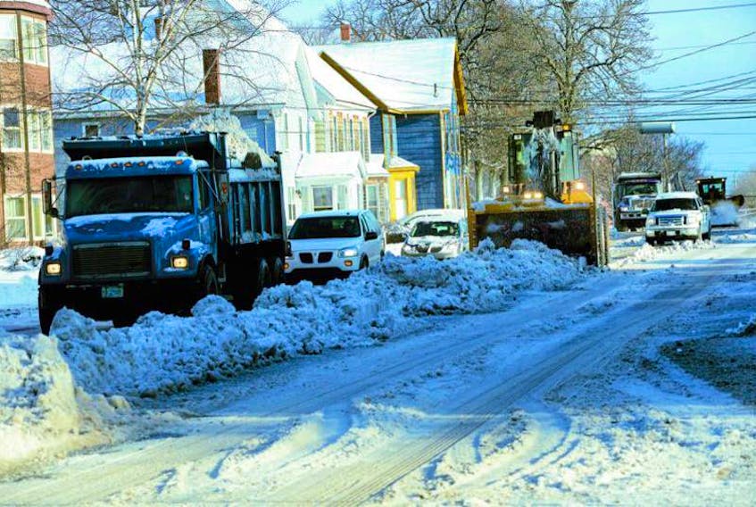 Cars, trucks, plows and blowers contend for space during snow removal on Grafton Street in Charlottetown following a 2015 storm.

(Guardian file photo)