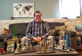 Terry Randell of Pasadena with some of the Lego Architecture kits of well-known landmarks that he has built, including a couple he’s built during Facebook Live sessions. CONTRIBUTED PHOTO