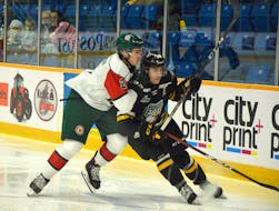 Shawn Element, right, of the Cape Breton Eagles battles Brendan Tomilson of the Halifax Mooseheads during a Quebec Major Junior Hockey League game last October in Sydney. Element was traded to Victoriaville during an already significant trading period which continues until Jan. 26. JEREMY FRASER • CAPE BRETON POST