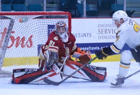 Davis Cooper of the Cape Breton Eagles attempts a shot on Acadie-Bathurst Titan goaltender Christian Sbaraglia during Quebec Major Junior Hockey League action at the K.C. Irving Regional Centre in New Brunswick earlier this month. CONTRIBUTED • TYSON GRAY, ACADIE-BATHURST TITAN 