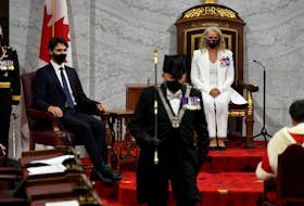  Governor General Julie Payette looks on with Chief of Defence Staff Jonathan Vance (L) and Prime Minister Justin Trudeau as the Usher of the Black Rod Greg Peters leaves to summon the House of Commons to come listen to the throne speech in the Senate chamber in Ottawa.